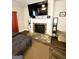 Living room view of fireplace with brick surround and decorative mantel with TV at 2275 Church St, Hampton, GA 30228