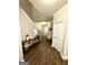 Welcoming foyer with wood floors, console table, and staircase at 2275 Church St, Hampton, GA 30228