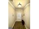 Neutral hallway with crown molding, coat rack, and warm lighting at 2275 Church St, Hampton, GA 30228