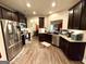 Open kitchen featuring stainless steel appliances and breakfast bar at 2275 Church St, Hampton, GA 30228