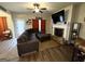Cozy living room features a brick fireplace, TV, and plush sectional sofa at 2275 Church St, Hampton, GA 30228