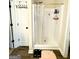 Shower with a clear shower curtain, shelving, and a mounted shower head at 2275 Church St, Hampton, GA 30228