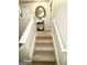 Carpeted staircase ascending to the upper level, with white railings at 2275 Church St, Hampton, GA 30228
