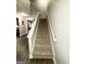 Carpeted staircase leading to the upper level of the home at 2275 Church St, Hampton, GA 30228
