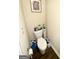 Toilet with wood floors and wall decor at 2275 Church St, Hampton, GA 30228