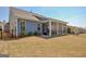 Well-maintained backyard with view of screened in porch perfect for relaxing outdoors at 108 Mulberry Ct, Peachtree City, GA 30269