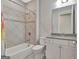 Neat bathroom features tiled shower over tub and vanity with a grey countertop, blending style and functionality at 108 Mulberry Ct, Peachtree City, GA 30269