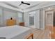 Cozy bedroom with open view into an adjoining bathroom featuring a tiled shower at 108 Mulberry Ct, Peachtree City, GA 30269