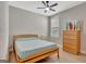 Cozy bedroom with wood floors, shutters, ceiling fan, and serene decor that provides a relaxing atmosphere at 108 Mulberry Ct, Peachtree City, GA 30269