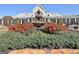 Beautiful community fountain surrounded by colorful flowers and manicured landscaping at 108 Mulberry Ct, Peachtree City, GA 30269