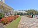 Paver walkway with manicured flower beds leading to the pool at 108 Mulberry Ct, Peachtree City, GA 30269