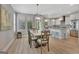 Bright dining area with backyard views seamlessly connected to the kitchen space at 108 Mulberry Ct, Peachtree City, GA 30269