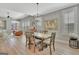 Elegant dining area adjacent to living room, with modern lighting and stylish decor at 108 Mulberry Ct, Peachtree City, GA 30269