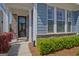 Inviting home entrance with a stylish front door, manicured landscaping, and a welcoming porch at 108 Mulberry Ct, Peachtree City, GA 30269