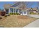 Charming two-story home with a two-car garage, blue siding, brick accents, and landscaped front yard at 108 Mulberry Ct, Peachtree City, GA 30269