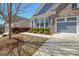 Charming two-story home with a two-car garage, blue siding, brick accents, and landscaped front yard at 108 Mulberry Ct, Peachtree City, GA 30269