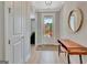 Inviting foyer with hardwood floors, stylish console table, and a clear view to the front yard at 108 Mulberry Ct, Peachtree City, GA 30269