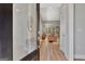 Bright foyer featuring hardwood floors, fresh gray paint, and open floor plan to the living area at 108 Mulberry Ct, Peachtree City, GA 30269