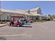 Several golf carts parked at the community clubhouse provide transportation for residents and guests at 108 Mulberry Ct, Peachtree City, GA 30269