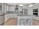 Modern kitchen featuring stainless steel appliances, granite countertops, and white cabinetry at 108 Mulberry Ct, Peachtree City, GA 30269