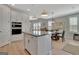 Bright kitchen island with granite countertop in a dining area at 108 Mulberry Ct, Peachtree City, GA 30269