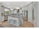 Bright kitchen with an island, stainless steel appliances, granite countertops, and pendant lighting at 108 Mulberry Ct, Peachtree City, GA 30269
