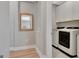 Well-lit laundry room with modern washer and dryer units, and storage at 108 Mulberry Ct, Peachtree City, GA 30269