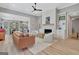 Spacious living room with a modern fireplace, white built-ins, and plenty of natural light at 108 Mulberry Ct, Peachtree City, GA 30269