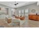 Spacious living room with modern furniture, a patterned rug, and ample natural light at 108 Mulberry Ct, Peachtree City, GA 30269