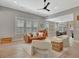 Bright living room featuring hardwood floors, fresh paint, modern furniture, and an open floor plan at 108 Mulberry Ct, Peachtree City, GA 30269
