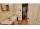 Bathroom featuring a sink, toilet, a towel and checkered wallpaper at 617 Virginia Cir, Forest Park, GA 30297