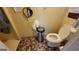 Bathroom featuring a toilet, trash can, and checkered tile floor at 617 Virginia Cir, Forest Park, GA 30297