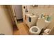 Small bathroom featuring a vanity, toilet, and linoleum flooring, offering a practical and compact space at 617 Virginia Cir, Forest Park, GA 30297