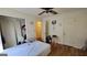 Bedroom featuring a ceiling fan, closet, and a view to the hallway at 617 Virginia Cir, Forest Park, GA 30297