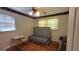 Cozy bedroom with hardwood floors and a unique ceiling fan, offering a basic yet comfortable space at 617 Virginia Cir, Forest Park, GA 30297