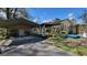 Wide shot of a carport with a metal roof and a concrete driveway on a clear day at 617 Virginia Cir, Forest Park, GA 30297