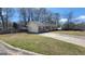 Single-story home featuring brick and siding, set on a green lawn with mature trees at 617 Virginia Cir, Forest Park, GA 30297
