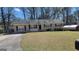 Charming brick ranch home with a well-maintained front yard and a long concrete driveway at 617 Virginia Cir, Forest Park, GA 30297