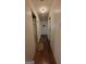 Hallway with hardwood flooring and white trim, showing access to several rooms at 617 Virginia Cir, Forest Park, GA 30297