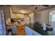 A spacious kitchen featuring white cabinets and modern appliances, with an adjoining dining area at 617 Virginia Cir, Forest Park, GA 30297