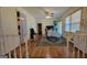 A transition to a bright living room, showing hardwood floors and an area rug at 617 Virginia Cir, Forest Park, GA 30297