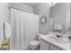 Bright bathroom features a white shower curtain, vanity, and mirror at 116 Evenview Dr., Jonesboro, GA 30236