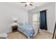 Cozy bedroom with a ceiling fan, neutral carpet, and a window provides natural light at 116 Evenview Dr., Jonesboro, GA 30236