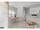 Bright dining area features an oval table, seating for six, and white cabinets for added storage at 116 Evenview Dr., Jonesboro, GA 30236
