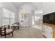 Inviting living space with vaulted ceilings, bright windows, and open access to the dining room at 116 Evenview Dr., Jonesboro, GA 30236