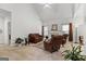 Spacious living room with a vaulted ceiling, neutral carpet, and a fireplace creates an inviting atmosphere at 116 Evenview Dr., Jonesboro, GA 30236