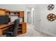 Practical office features a desk, storage, and easy access to other rooms at 116 Evenview Dr., Jonesboro, GA 30236