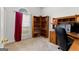Functional home office with built-in shelving, a desk, and a large window at 116 Evenview Dr., Jonesboro, GA 30236