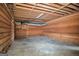 Unfinished basement features exposed wooden beams and concrete floors, offering potential for customization at 4230 Iris Brooke Ln, Snellville, GA 30039