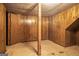 Partially finished basement with wood paneled walls, offering potential for a cozy living space at 4230 Iris Brooke Ln, Snellville, GA 30039